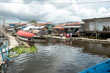 Bellavista port of Amazon river in Iquitos, Peru. Amazonia, Nanay River tributary of Amazon River. South America - obrazy, fototapety, plakaty