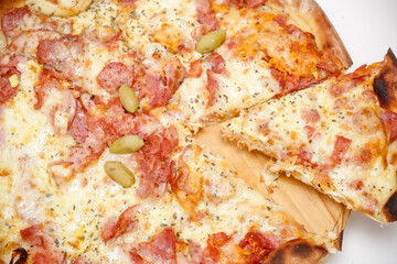 Large sliced Canadian chicken pizza with delicious flavor.
