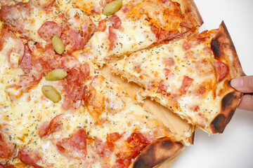 Large sliced Canadian chicken pizza with delicious flavor.
