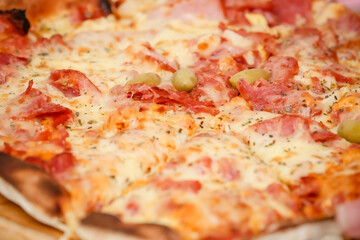 Large sliced Canadian chicken pizza with delicious flavor.
