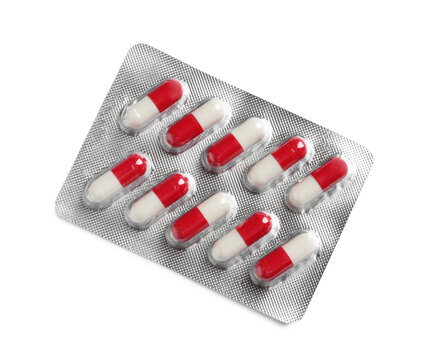 Blister with bright pills isolated on white, top view