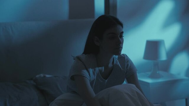 insomnia problem feeling lonely woman bed night