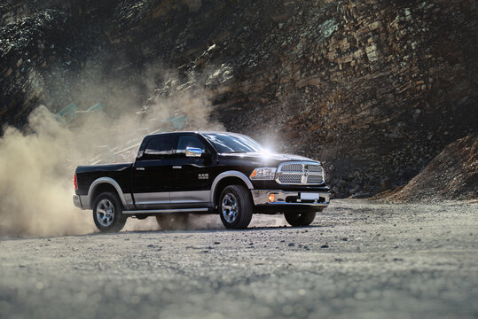 Brno, Czech Republic - June 15 2014: Dodge RAM 1500 with dust swirling from the quarry in which it is driving.