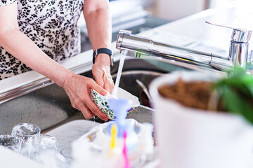 Fototapeta na wymiar japanese senior woman washing dishes