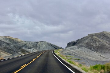 road through grey rock