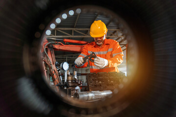 An excavator repair technician use vernier caliper and holding bulldozer sprocket to inspection and...