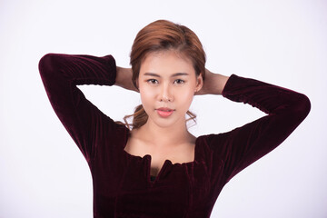 Hmm, must think! The dark brown-haired girl pondered, pondered, scratched her head with doubt and uncertainty, with a puzzled and indecisive face. Shot in a separate indoor studio on a white backgroun