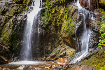 Majestic waterfall in Vancouver, Canada. View with mountain background.