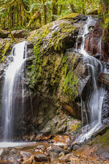 Majestic waterfall in Vancouver, Canada. View with mountain background.