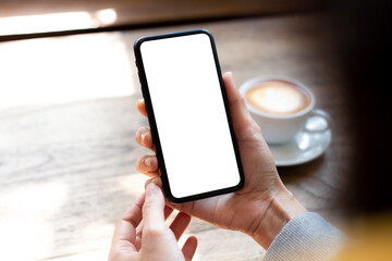 cell phone blank white screen mockup.woman hand holding texting using mobile on desk at office.background empty space for advertise.work people contact marketing business,technology