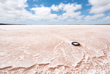 Old Tire left on a Pink Salt Covered Lake - Bumbunga Lake, Lochiel, South Australia