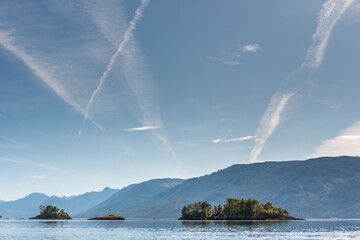 Jet airplane contrails above Johnstone Strait, North Vancouver Island, Canada