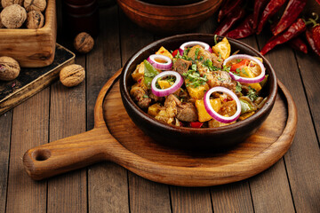 Georgian dish lamb ojahuri with potato stew in a bowl