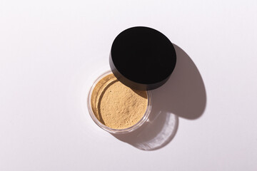 Mineral powder foundation isolated on a white background. Eco-friendly and organic beauty products