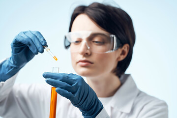 Woman in white coat test tube chemical solution analysis diagnostics