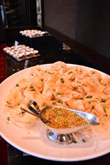 buffet party catering with lo hei yu sheng, asian and western cuisine, canapé and butler, dessert and drink halal menu for Chinese new year decoration celebrate fine dining at luxury hotel restaurant
