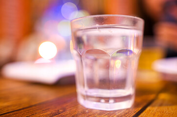 A glass glass stands on a table