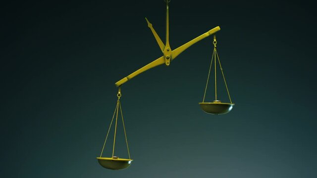 Yellow jewelry retro weigher . The scales are unsteady until they balance . Symbol of justice . Weights on the scales . Studio shot on RED EPIC Cinema Camera with strobe light .
