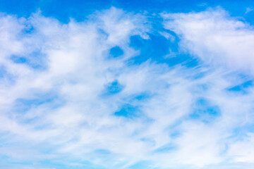 White clouds on a blue sky as background