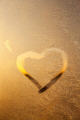 Fototapeta premium heart painted on a window in winter