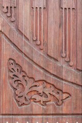 Fragment of a wooden gate with figured carving