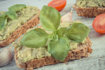 Sandwiches with paste of avocado. Healthy food as source omega acids, vitamins and minerals