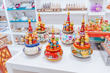 Assortment of various Russian wooden handmade souvenirs of St. Basil Cathedral for sale in torist...