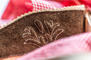 Close-up of details of a bavarian folk costume leather pants