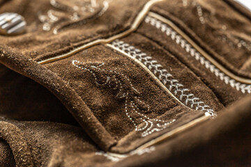 Close-up of details of a bavarian folk costume leather pants