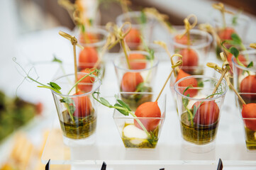 Sandwiches, canapes and cakes on the festive table. A wide variety of snacks
