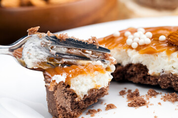 tartlet with milk cheese filling and lots of salted caramel with nuts