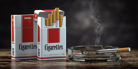 Packs of cigarettes with ashtray on vintage table. © Maksym Yemelyanov