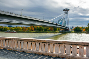 bratislava, slovakia - OCT 16, 2019: bridge through danube. sunny weather with clouds on the sky. cityscape of slovakian capital in autumn. view from the downtown side of the river