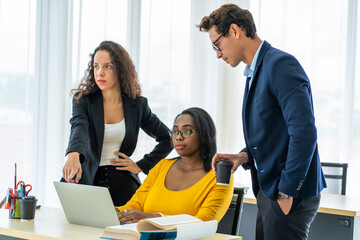 Group of colleagues of black worker chatting with a multinational Latino girl friend, and the boss came to say hi at work in the morning at the office. 