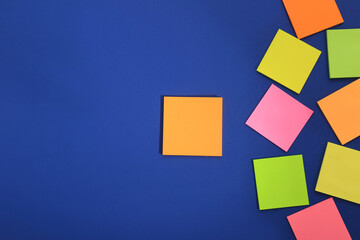 Many colorful stickers on blue background, flat lay. Space for text