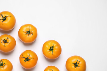 Fresh ripe yellow tomatoes on white background, top view