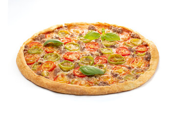 Italian meat pizza with tomatoes, three types of meat (sausages, bacon, minced meat), mozzarella cheese decorated with green basil leaves.