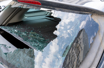 Criminal incident. Hacking the car. Broken rear window of a car.