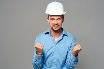 man in blue shirt engineer construction helmet safety work