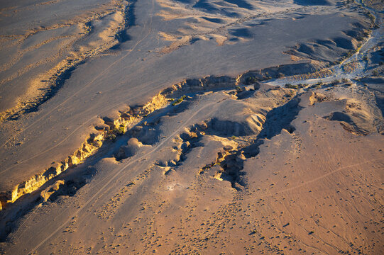 Aerial images of arid regions in Africa, harsh desert environment. Popular tourist destination in Africa, the Namibian desert landscape.