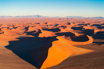 Aerial images of arid regions in Africa, harsh desert environment. Popular tourist destination in Africa, the Namibian desert landscape.