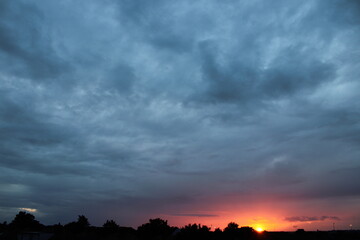 sunset clouds over the city