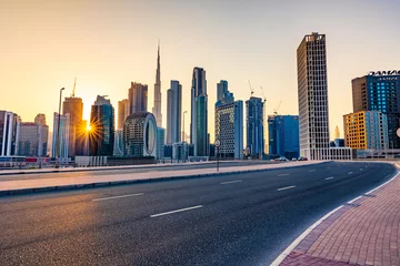 Tuinposter Dubai, United Arab Emirates - August 13 2021: Beautiful view of Dubai city skyscrapers or skyline along with Burj khalifa captured from Marasi Drive at Business Bay District, Dubai, UAE. © Sudarsan Thobias