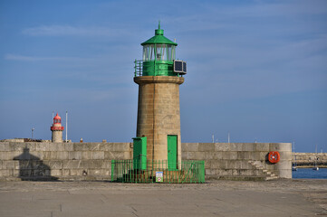 Beautiful evening view of red and green East and West Pier lighthouses in Dun Laoghaire harbor, Dublin. Ireland, Soft and selective focus