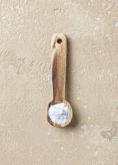 baking soda in wooden spoon