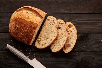 Homemade tartine bread on dark wooden table