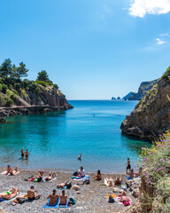 Obraz premium Bay of Ieranto Beach in a hot summer day, blue sea like a paradise. From the bay ( a protected area of the FAI) it is possible to see Punta Campanella and the Faraglioni of Capri. Naples, Italy