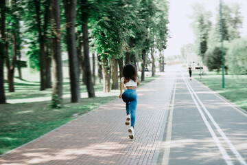 rear view. young woman on a morning jog .