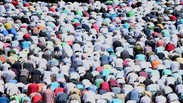 Muslim worshipers praying. Large crowd of Muslim people praying namaz. Muslims praying. Bosnians commemorate 24th anniversary of Srebrenica genocide. Religion.	