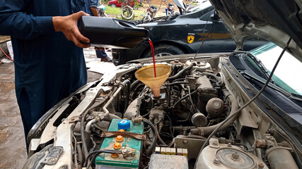 mechanic changing engine